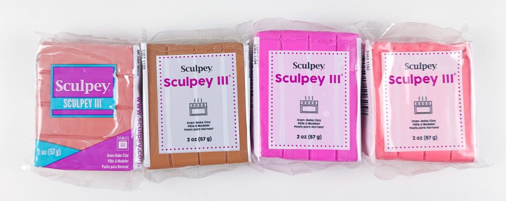 Packages of Sculpey III polymer clay showing the older and newer packaging.