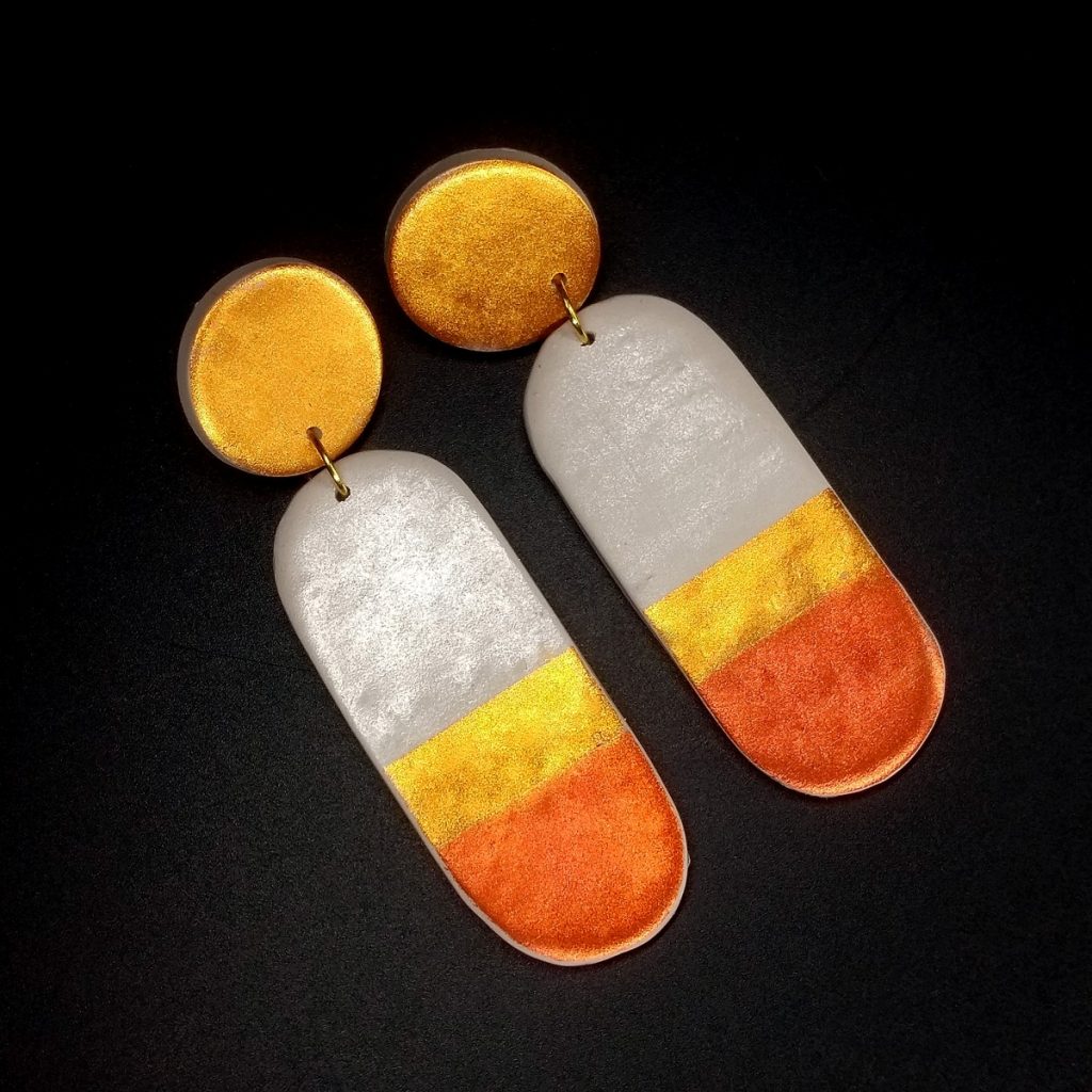 Striped pill-shaped polymer clay earrings