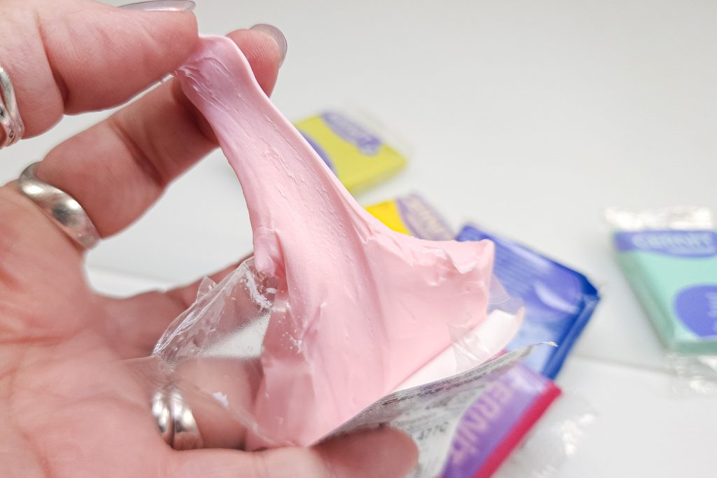 A fresh package of Cernit Colored Translucent (pink quartz) showing how soft and sticky the clay is, similar to taffy.