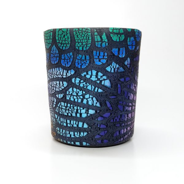 Small glass votive covered with a sheet of crackled patterned polymer clay. Note that the base clay is black and the crackle pattern is created with light pastels.
