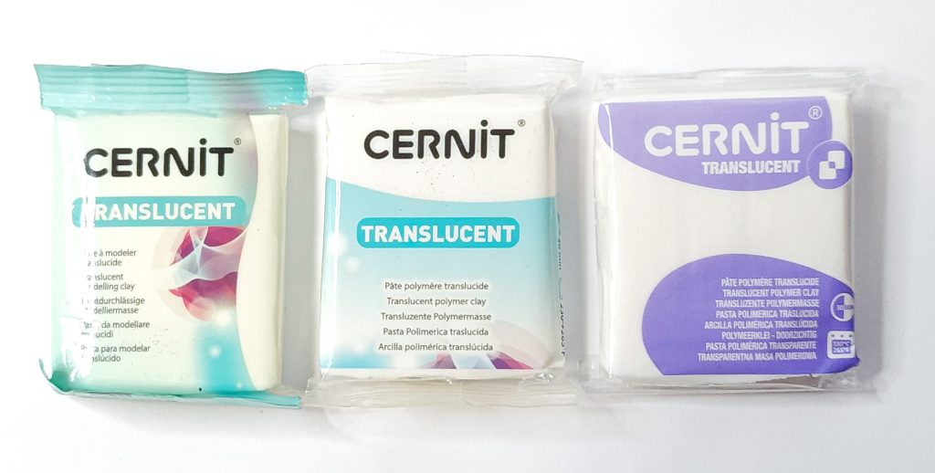 Three packs of Cernit Translucent polymer clay, each showing a different packaging design.
