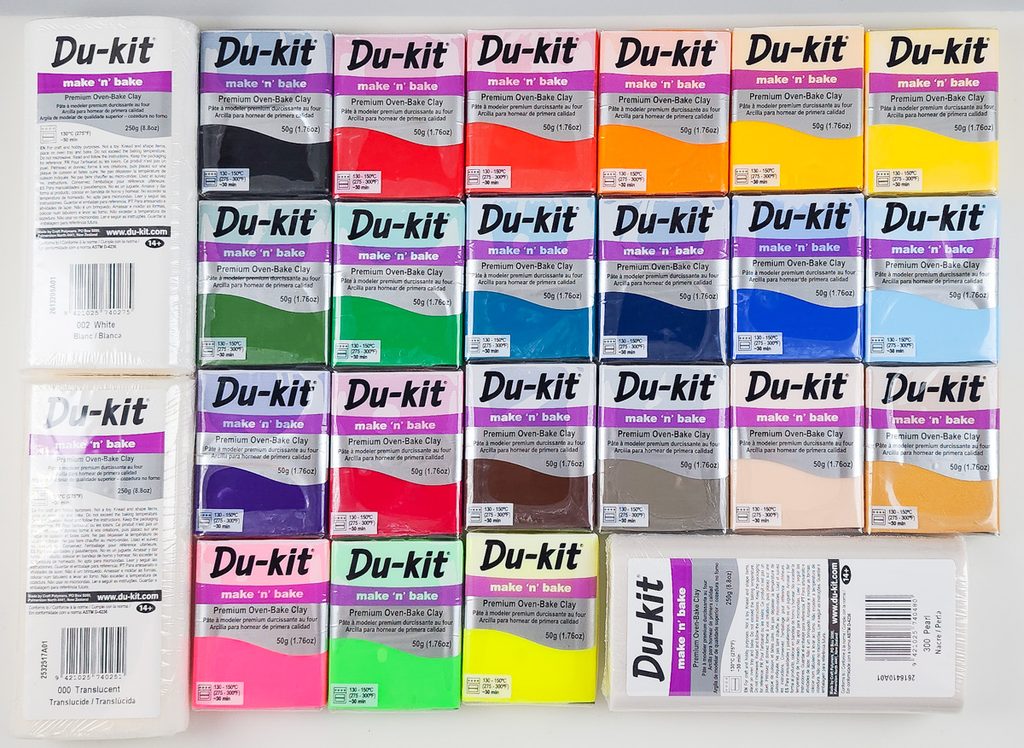 Flat lay of all 24 colors of Du-kit polymer clay showing all the colors that are available.