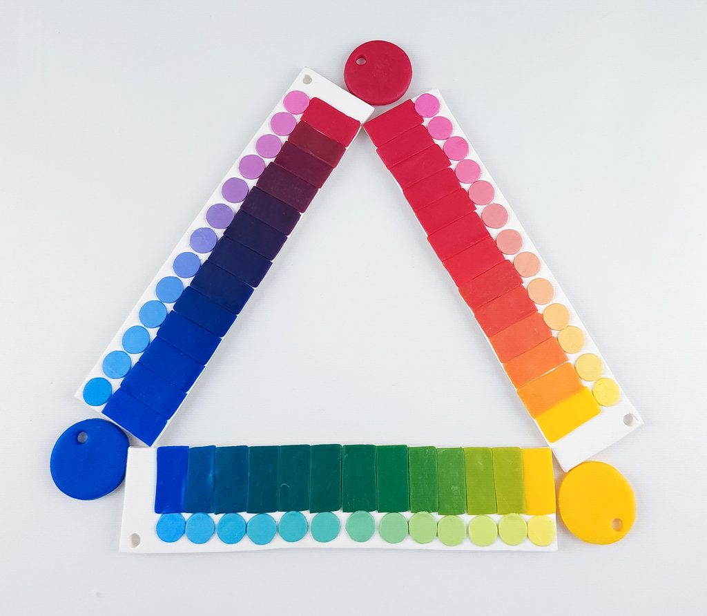 Color dilution strips made from polymer clay showing the serial dilutions of Du-kit ruby, yellow, and blue.