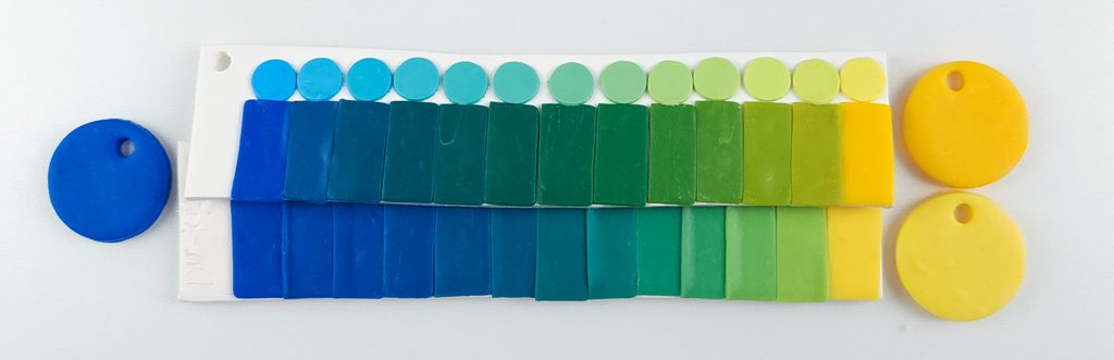 Polymer clay color strips, showing the stepwise dilution from blue to yellow made with Du-kit.