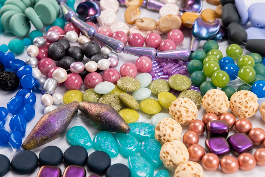 An assortment of colorful polymer clay beads.